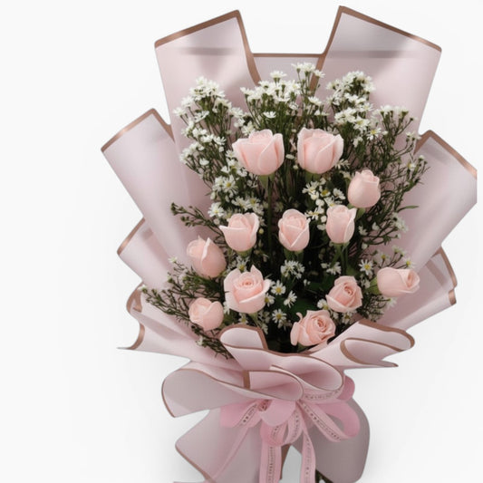 The Flowercart Autumn Morning bouquet featuring 12 premium pink roses and white fillers in elegant pink wrapping.
