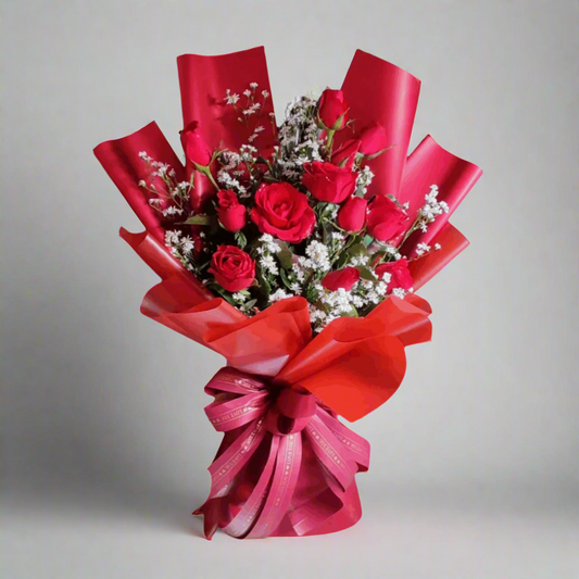 Bouquet of red roses, with red ribbons 