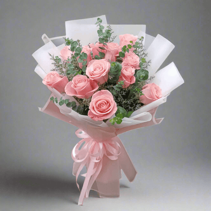 Bouquet of pink roses with greenery on a white background