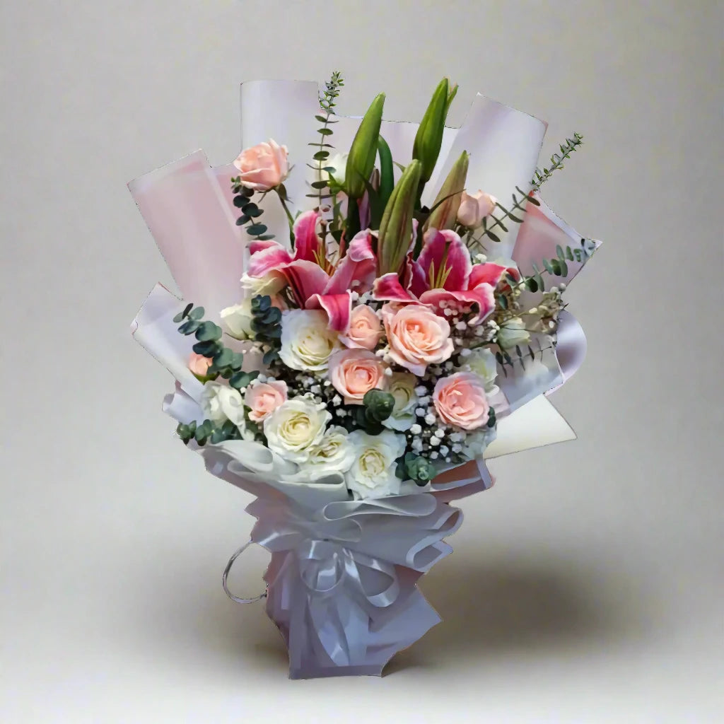Bouquet of flowers with pink and white roses on a light gray background