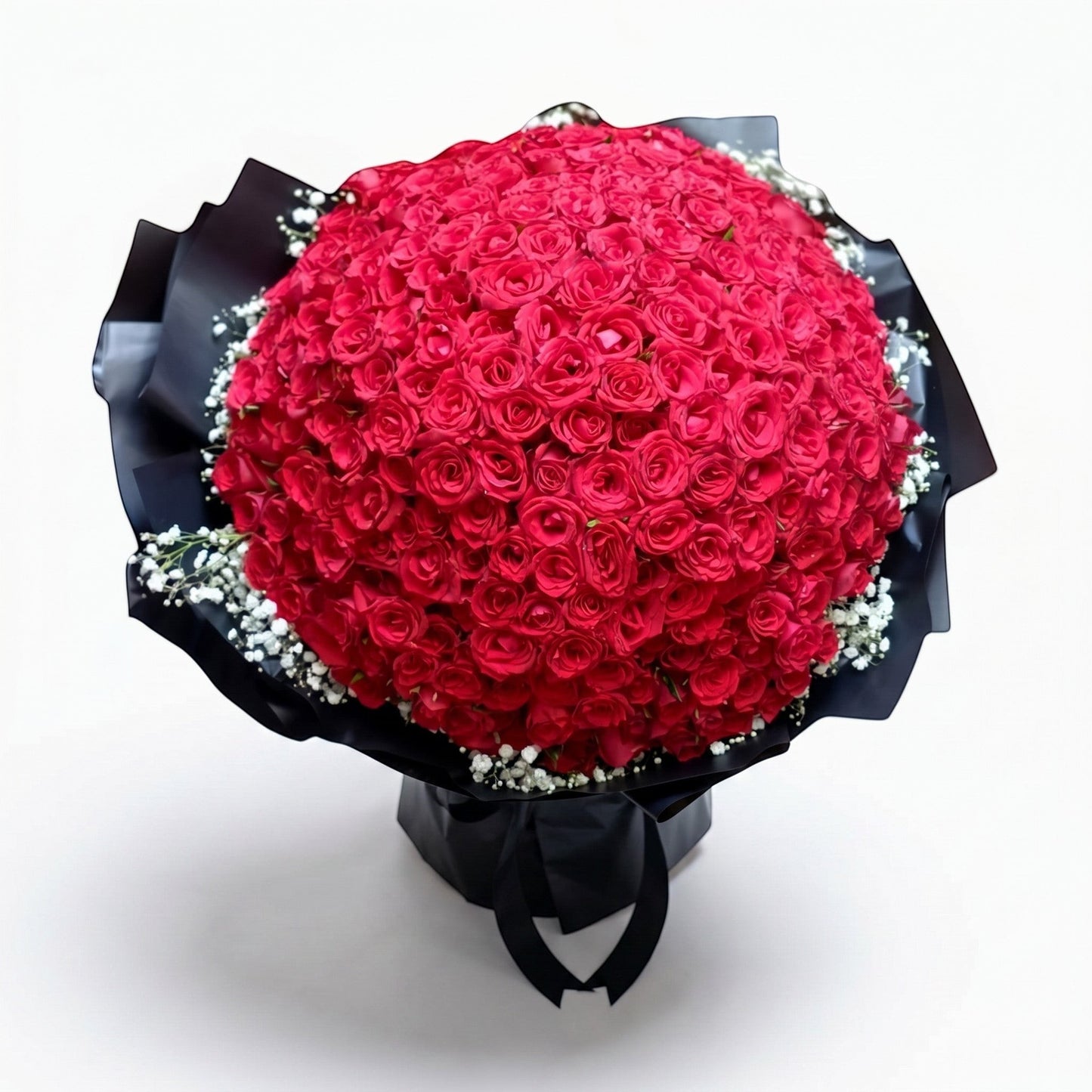 The Flowercart opulent bouquet of 199 red roses with baby's breath, wrapped in dramatic black paper for romance.