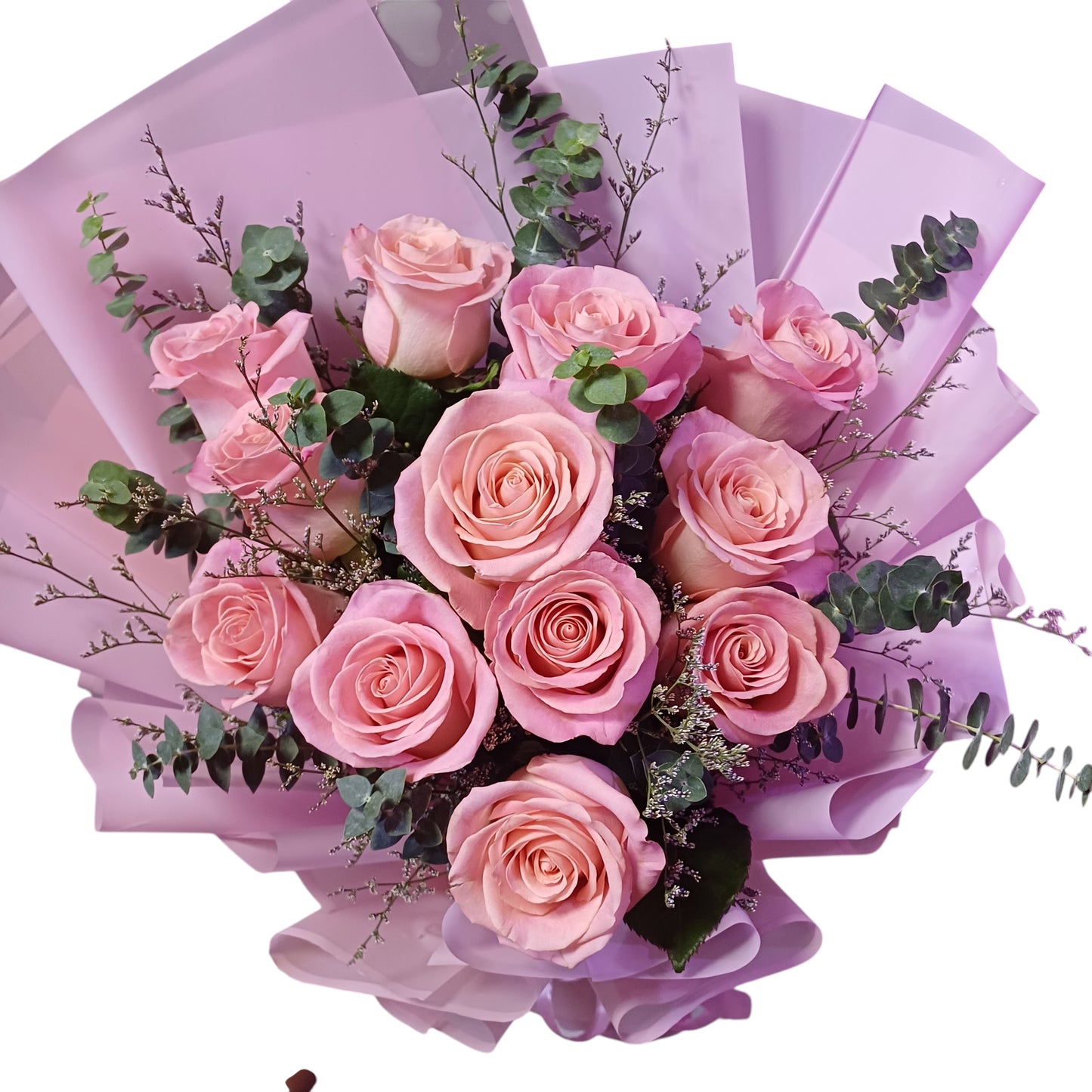 The Flowercart Château Bloom bouquet featuring twelve pink Ecuadorian roses with eucalyptus and misty fillers.
