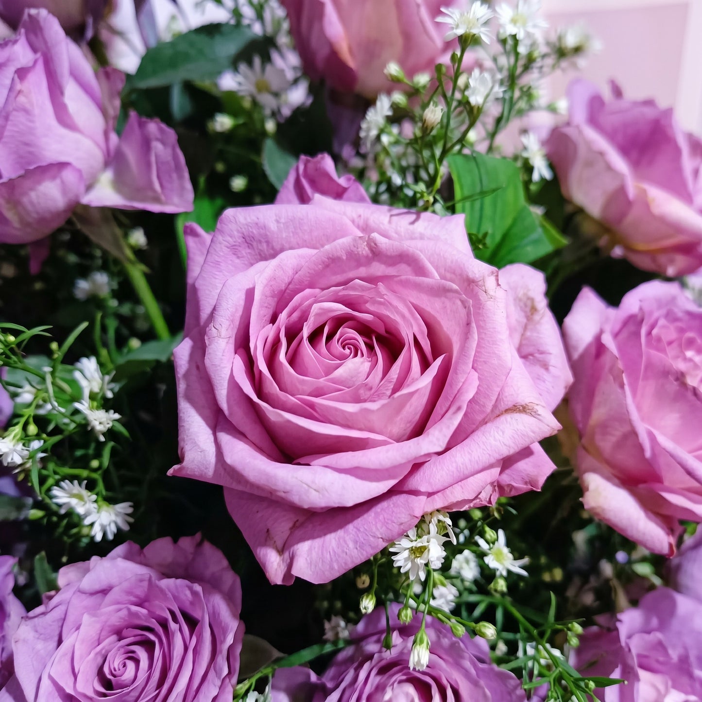 The Flowercart Save the Date bouquet featuring 12 elegant lavender roses with white filler flowers