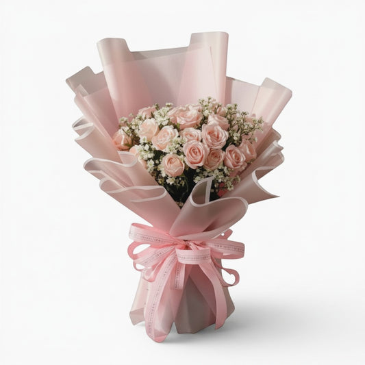 The Flowercart Dreaming of you bouquet with 24 pink roses and baby's breath wrapped in elegant soft pink paper