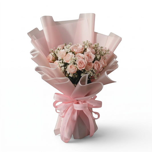 Flowercart Dreaming of you bouquet featuring 24 soft pink roses and baby's breath in elegant pink wrapping paper.