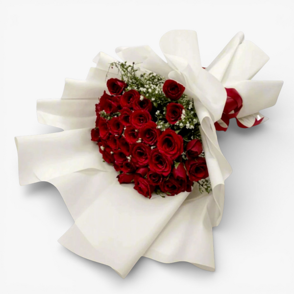 The Flowercart's Forever Spring bouquet: 48 red roses with white baby's breath, wrapped in white paper. Ideal for romantic occasions.