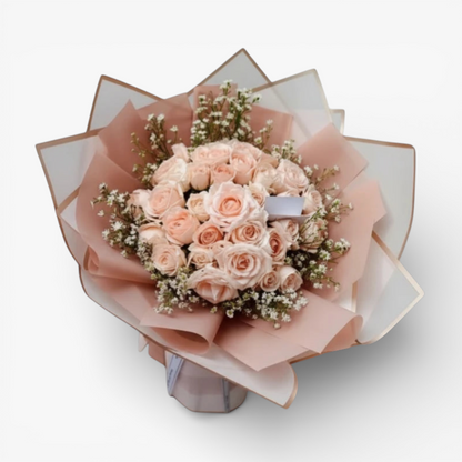 The Flowercart 50 pink roses and baby's breath bouquet, elegantly wrapped in pink and white paper.