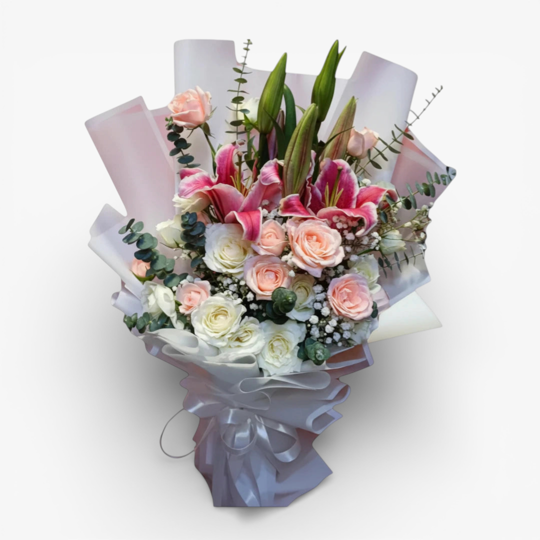 The Flowercart Caitlyn bouquet: 24 white & pink roses, Stargazer lilies, eucalyptus, gypsophila. Elegant floral arrangement.