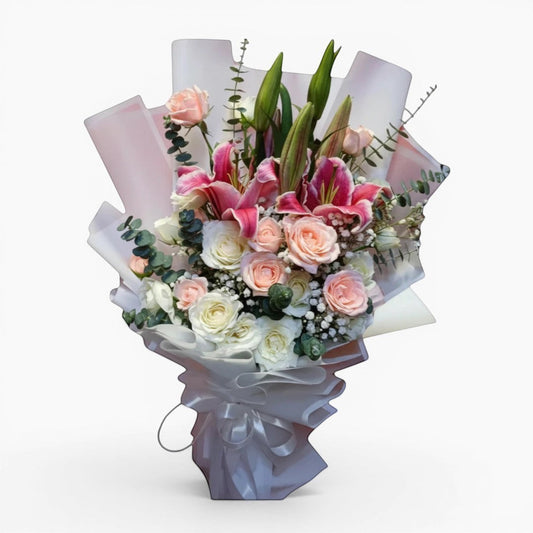 The Flowercart Caitlyn bouquet: 24 white & pink roses, Stargazer lilies, eucalyptus, gypsophila. Elegant floral arrangement.