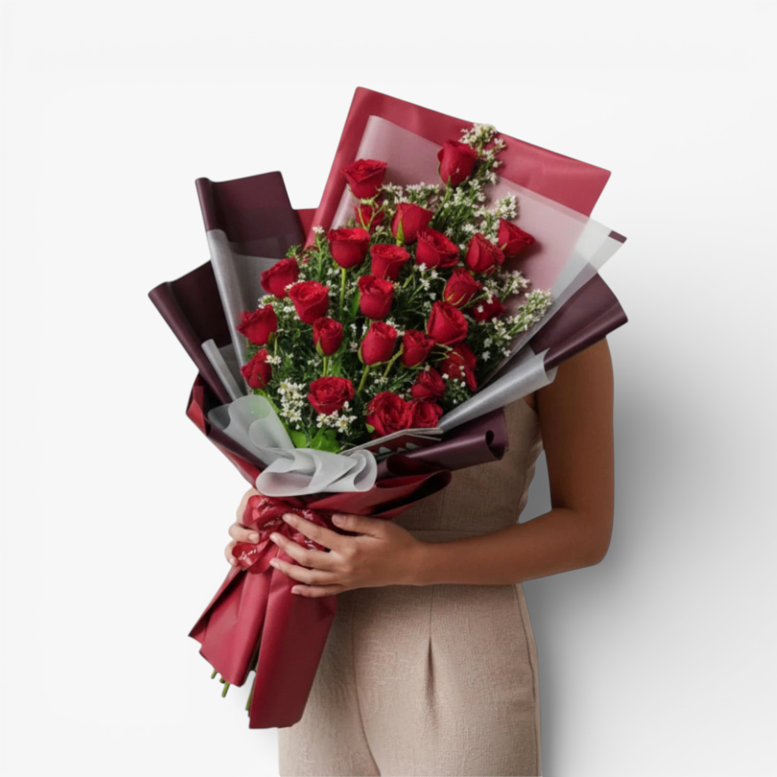 The Flowercart's Crimson Whisper bouquet: 24 red roses with white filler flowers, wrapped in burgundy and red paper, tied with a ribbon.